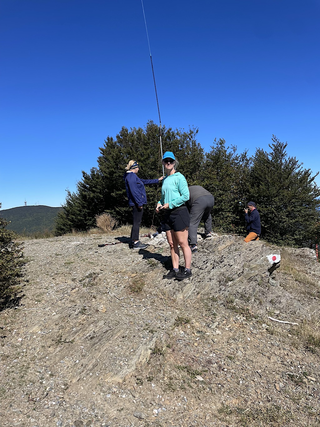 A group was setting up antennas to do long-distance radio transmissions from this peak.