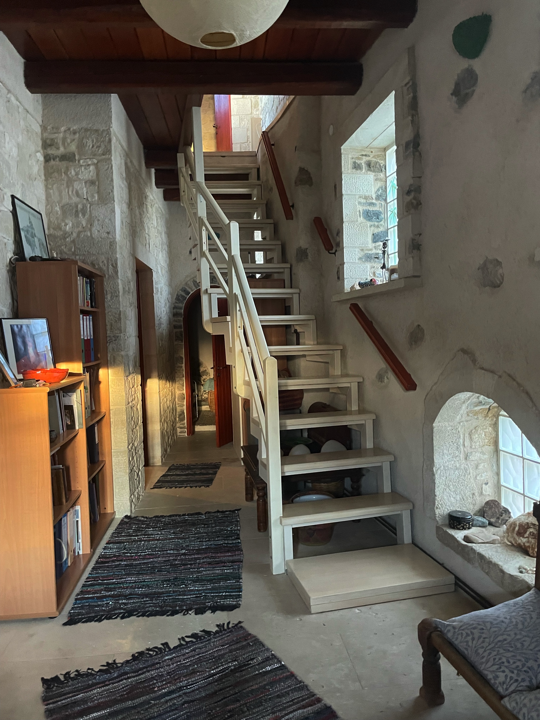 The stairs up to the living room and kitchen