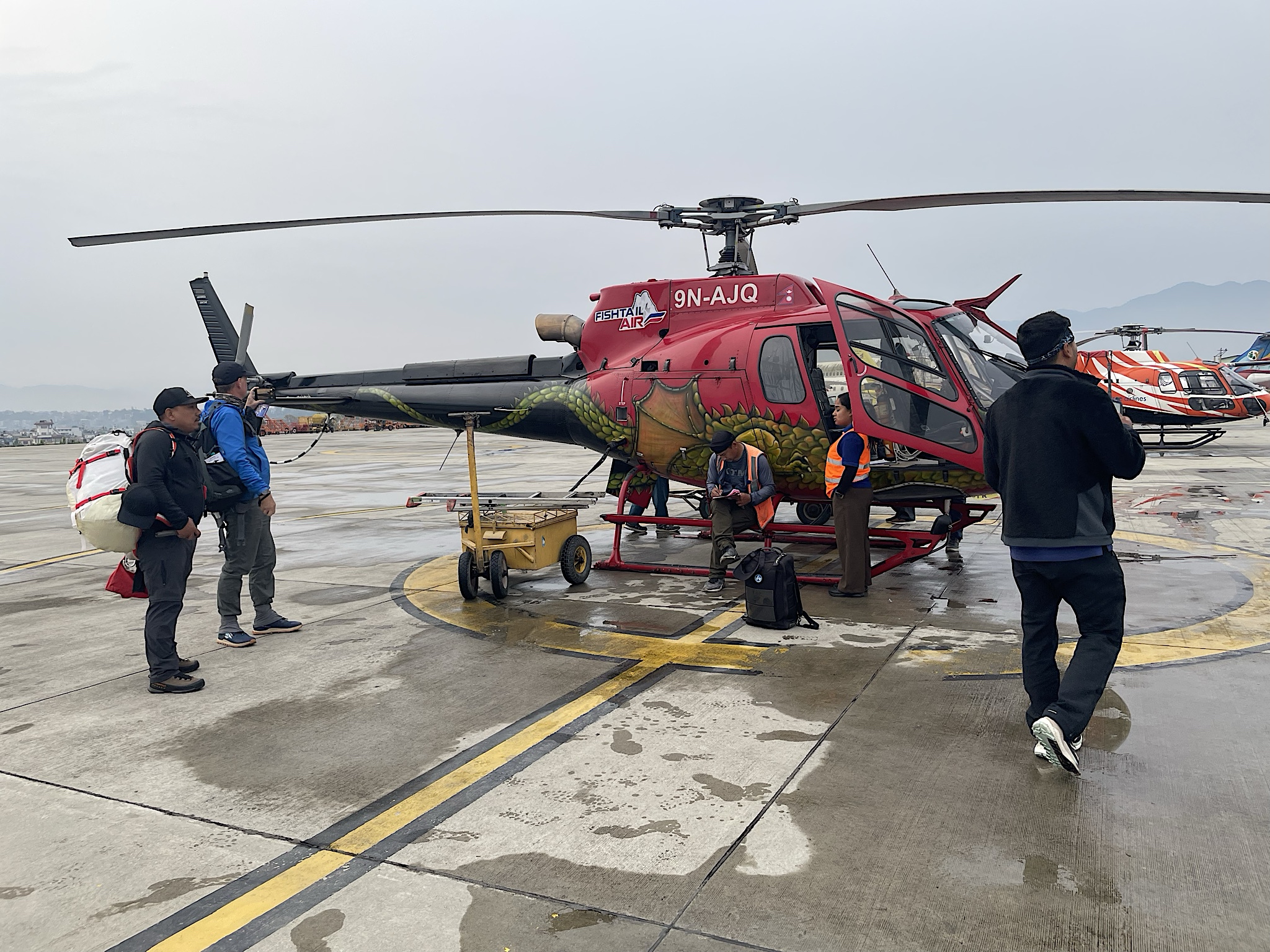 The guys loaded a bunch of bags of rice and stuff onto the helicopter with us.
